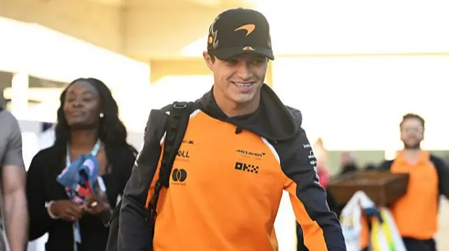 Lando Norris arrives in the paddock