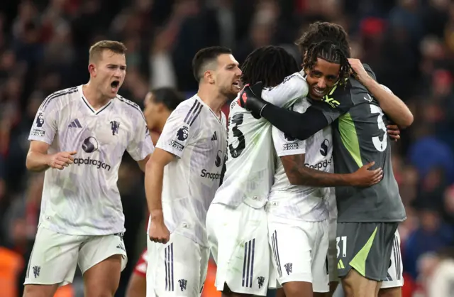 United players celebrate at full time