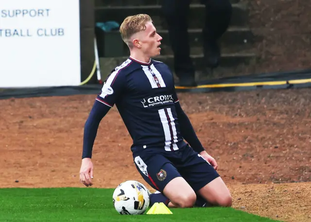 Joe Westley slides on his knees in celebration