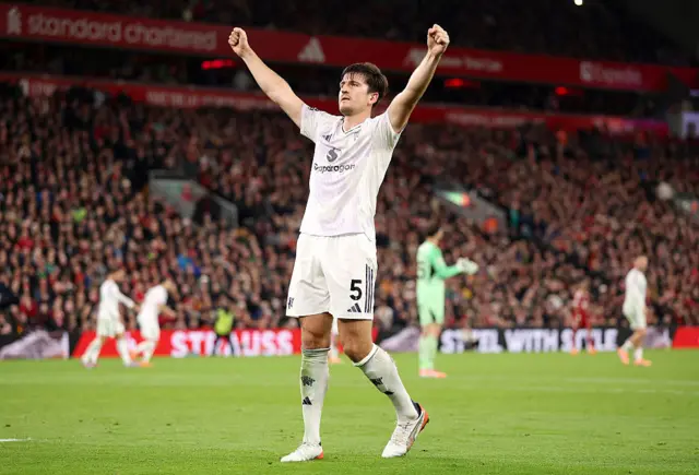 Maguire celebrates in front of the away fans after scoring