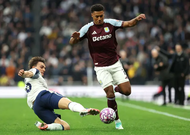 Ollie Watkins of Aston Villa is challenged by Joao Palhinha of Tottenham Hotspur