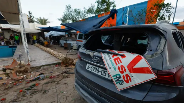 A general view of the site of an Israeli airstrike that targeted a residential compound housing employees of the Palestine Media Production Company, according to the civil defense, in Zawaida in the central Gaza Strip, October 19, 2025