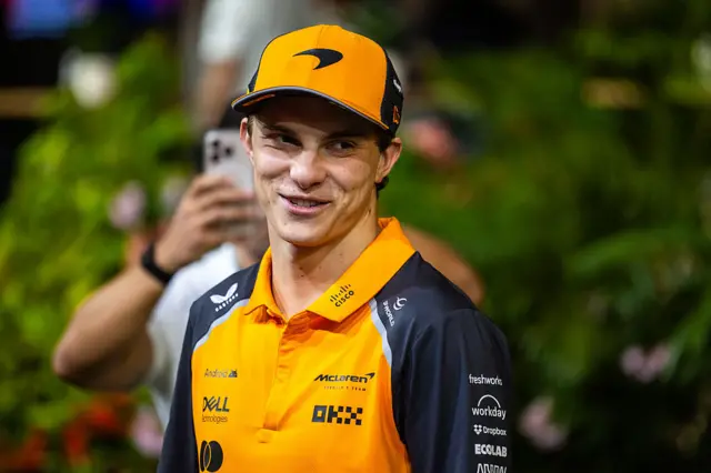 Oscar Piastri smiles in the Singapore paddock