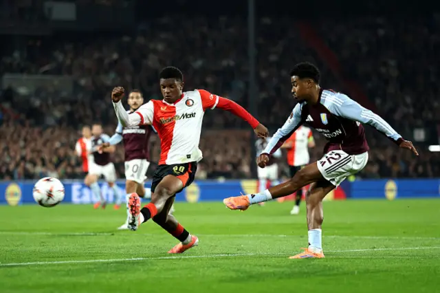 Ian Maatsen of Aston Villa shoots past Givairo Read of Feyenoord
