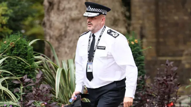 Met Assistant Commissioner Laurence Taylor walks on Downing Street