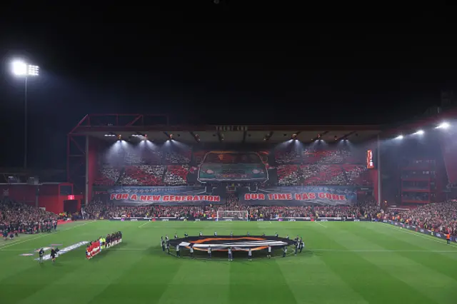 General view inside the stadium as players line up on the pitch