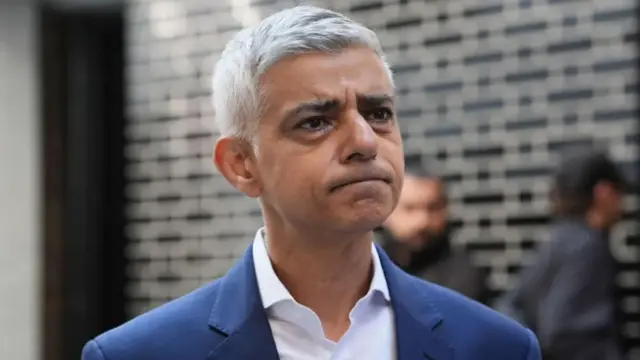 London Mayor Sadiq Khan frowning in suit