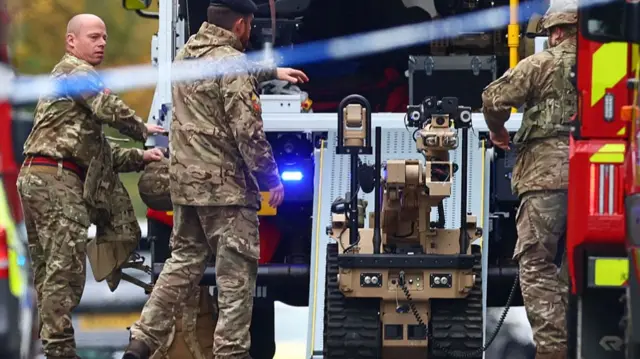 A bomb disposal robot was pictured at the scene earlier on