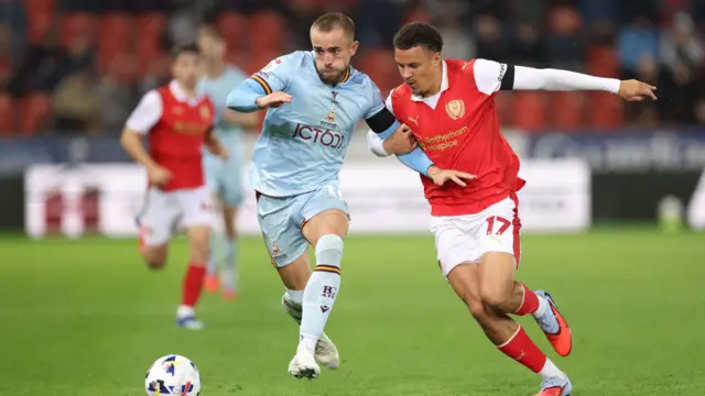 Alex Pattison of Bradford City battles with Shaun McWilliams of Rotherham