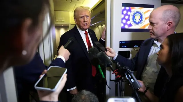 President Donald Trump speaks to members of the press on October 19, 2025 aboard Air Force One.