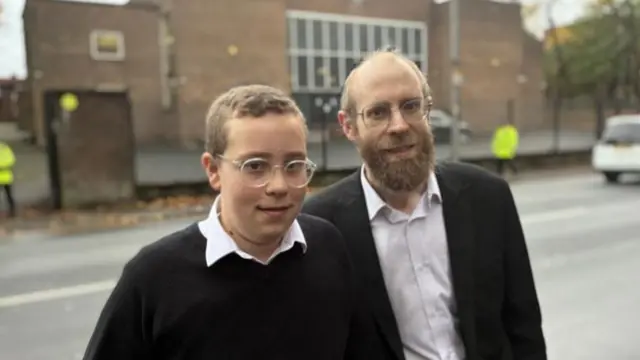 Raphael Schleider and his son Yakov waiting for King Charles to arrive