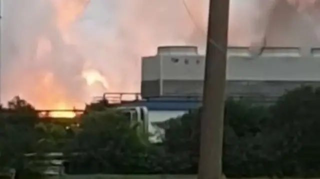 A structure on the right of the frame could be matched with Google Earth satellite imagery - the fire from the explosion can be seen on the left