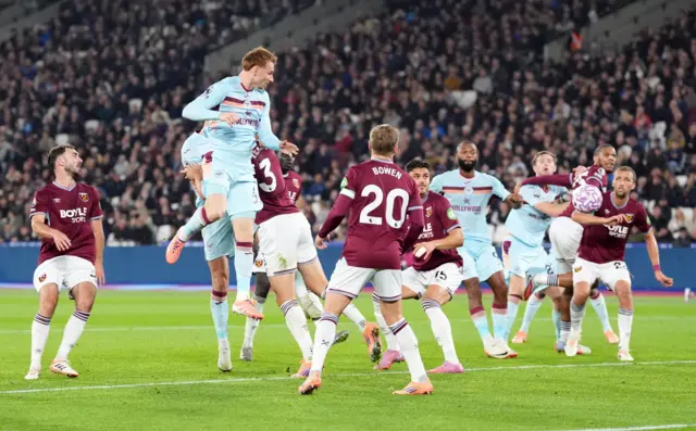 Brentford's Sepp van den Berg heads towards goal