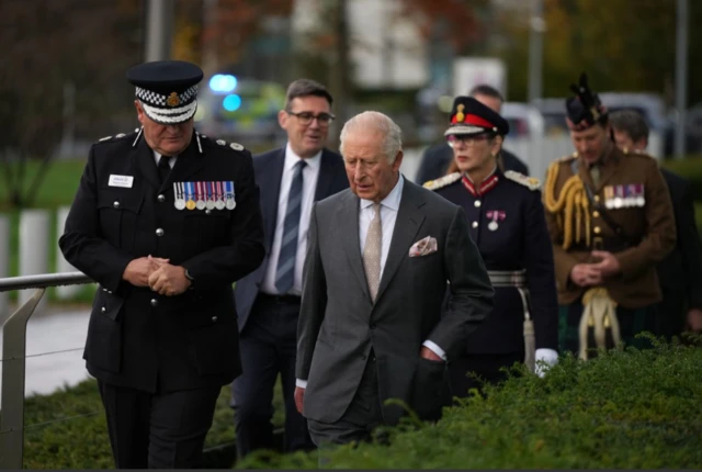 King with senior police chiefs, at GMP headquarters