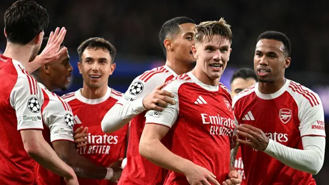 Arsenal players celebrate a goal
