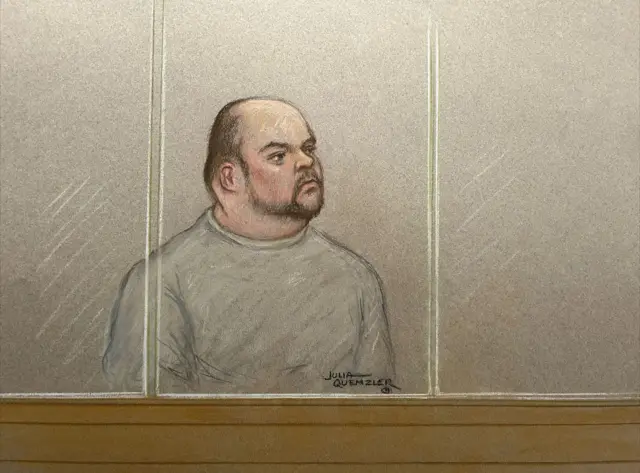 Court sketch of Gavin Plumb sitting in the dock wearing a pale green sweatshirt.