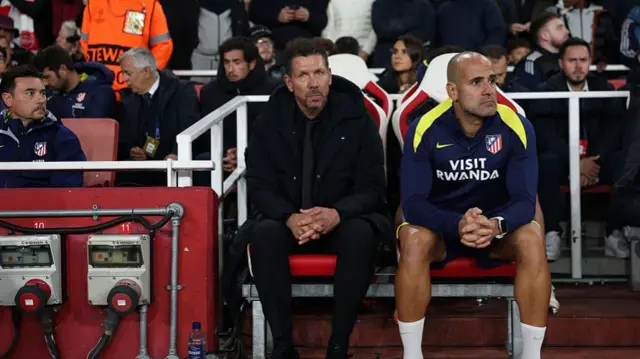 Diego Simeone in the dugout at Emirates Stadium