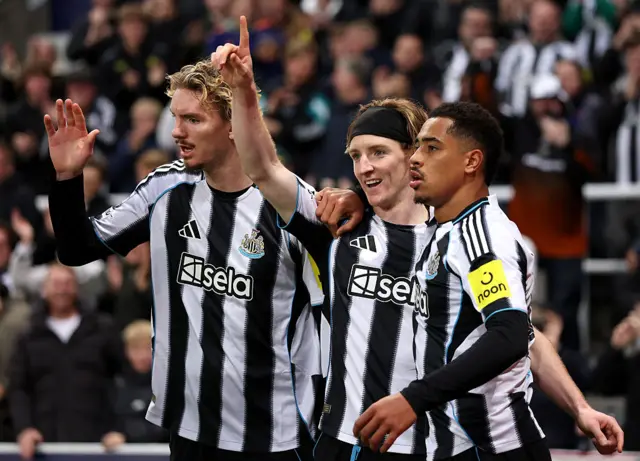 Newcastle players celbrate a goal
