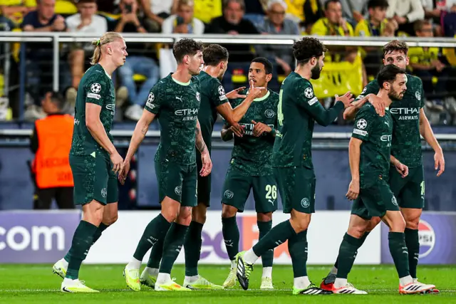 Manchester City players celebrate scoring
