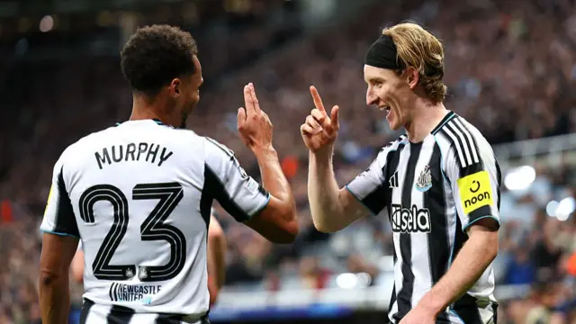 Jacob Murphy and Anthony Gordon celebrate a goal