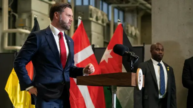 Vance speaking at the news conference in Israel