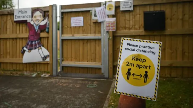 A 2m distance apart social distancing sign is seen in an empty playground