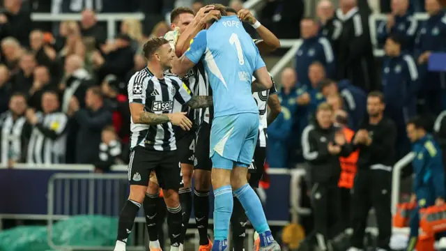 Nick Pope celebrates with Newcastle team mates