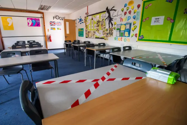 An empty classroom is seen