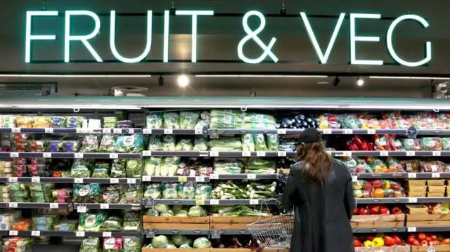 A shopper browses in a store in London