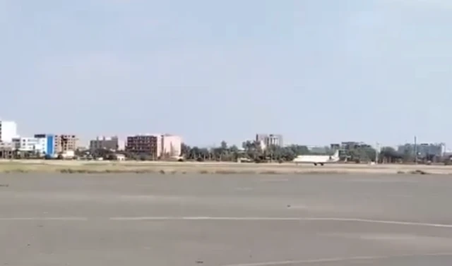 A screengrab of a video with a plane on Khartoum airport's runway