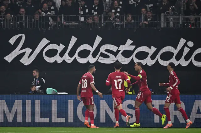 Liverpool players celebrate a goal