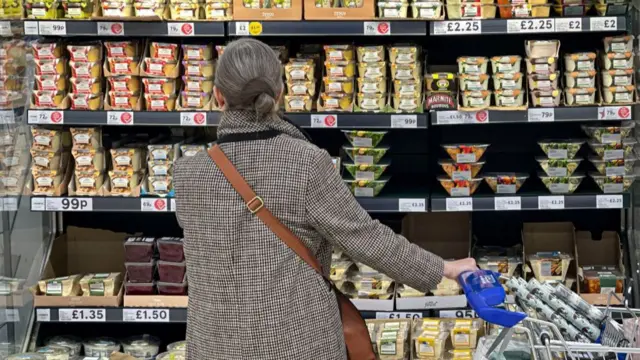 A woman shops for food at the grocery store