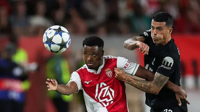 Ansu Fati and Pedro Porro compete for the ball