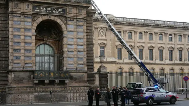 French police officers stand next to a furniture elevator used by robbers to enter the Louvre Museum, on Quai Francois Mitterrand, in Paris on October 19, 2025.