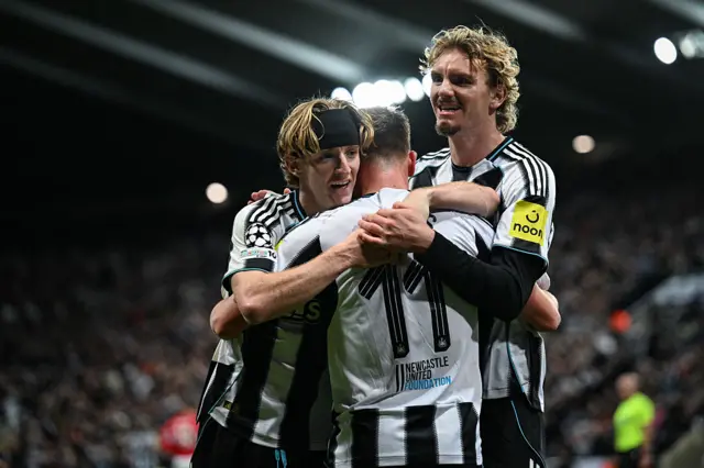 Newcastle's Harvey Barnes and Anthony Gordon celebrate with Nick Woltemade