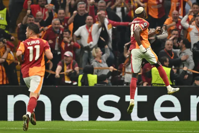 Victor Osimhen (R) celebrates scoring his team's second goal