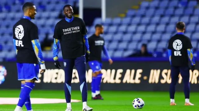 Sheffield Wednesday players warm up