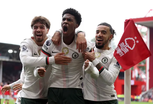 Josh Acheampong of Chelsea celebrates scoring his team's first goal with teammates Marc Guiu and Malo Gusto