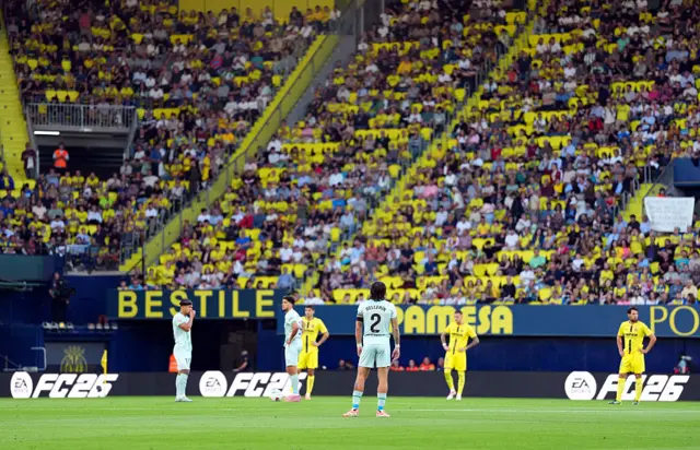 Players of Villarreal and Real Betis stand still after kick-off in protest against game in Miami