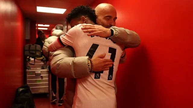 Enzo Maresca, Manager of Chelsea, embraces Estevao of Chelsea following the team's victory
