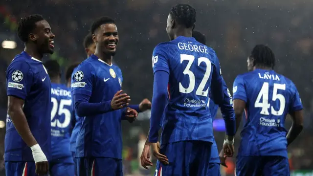 Tyrique George of Chelsea celebrates with teammates after scoring