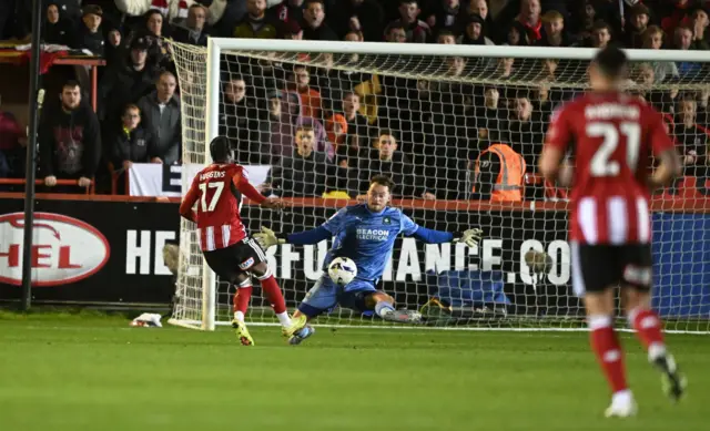 Akeel Higgins of Exeter City scores