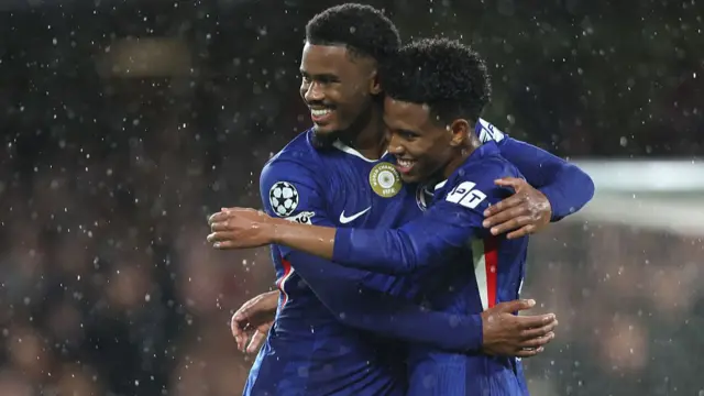 Chelsea's Estevao celebrates scoring his side's fourth goal with Jorrel Hato