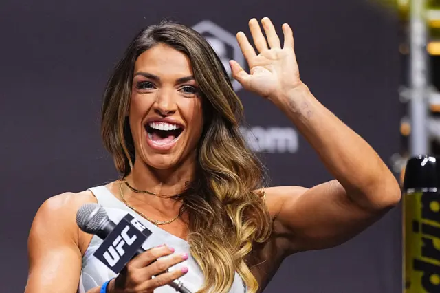 Mackenzie Dern smiles and waves