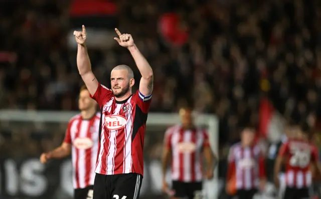Pierce Sweeney of Exeter City celebrates at the final whistle
