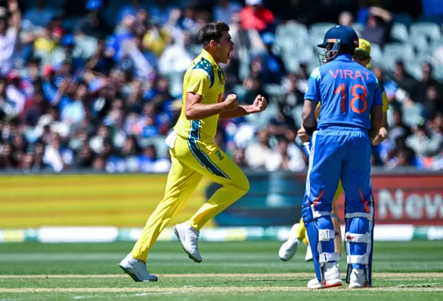 Xavier Bartlett celebrates Viat Kohli's wicket