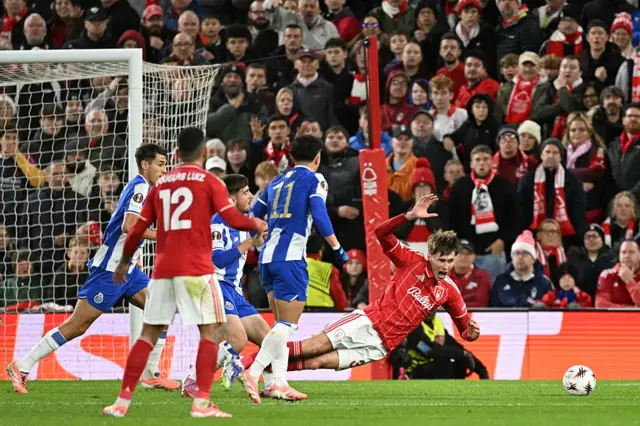 Nottingham Forest's Italian defender #37 Nicolo Savona (R) is fouled in the area to win a second penalty for his club during the UEFA Europa League league-stage football match between Nottingham Forest and Porto at The City Ground in Nottingham, central England, on October 23, 2025.