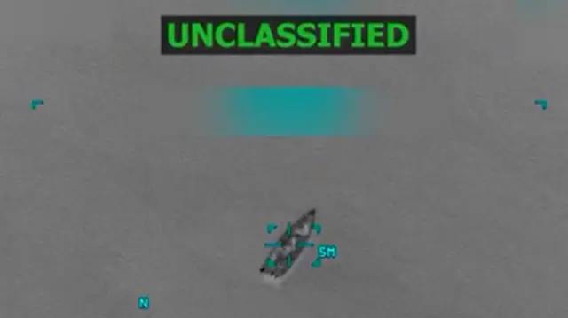 A screengrab from a US military video showing a boat being targeted for an air strike