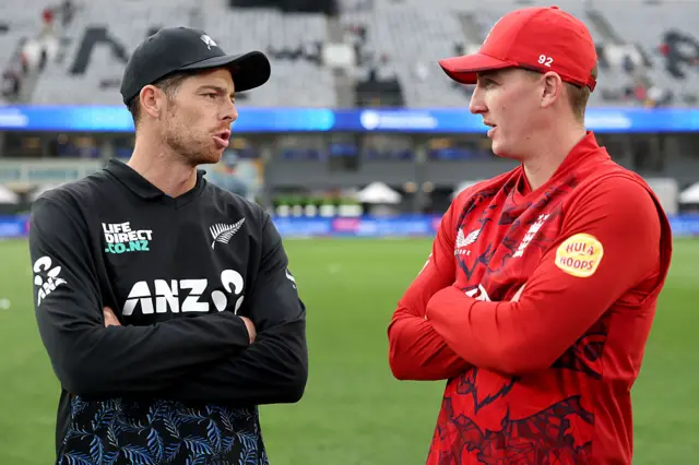 Mitch Santner and Harry Brook have a chat before the toss