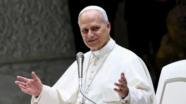 Pope Leo in a white robe